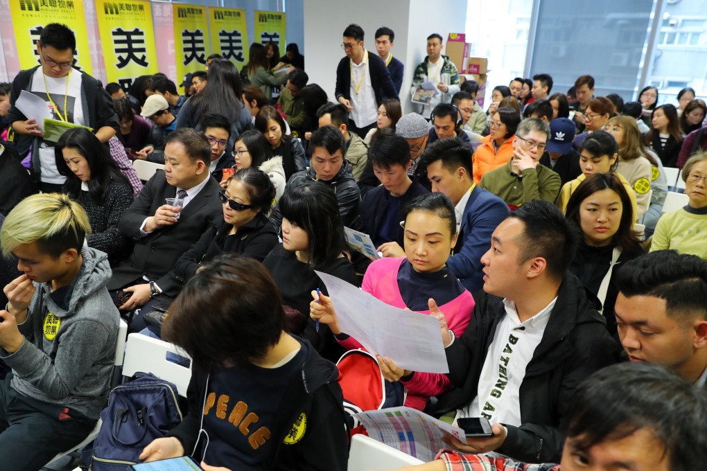 Potential buyers queue at the sales event for 118 units at Carmel apartment complex, a development by Wing Tai Properties. Photo: Edmond So