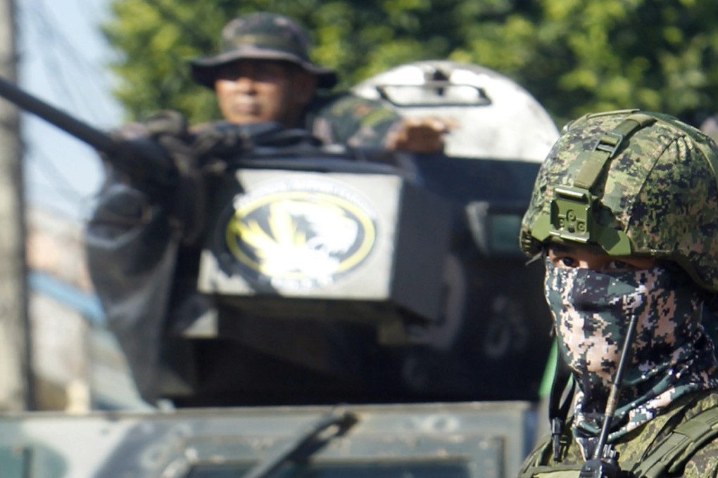 Philippine government troops conduct a patrol in Jolo town, on the volatile island of Sulu, southern Philippines. Photo: EPA