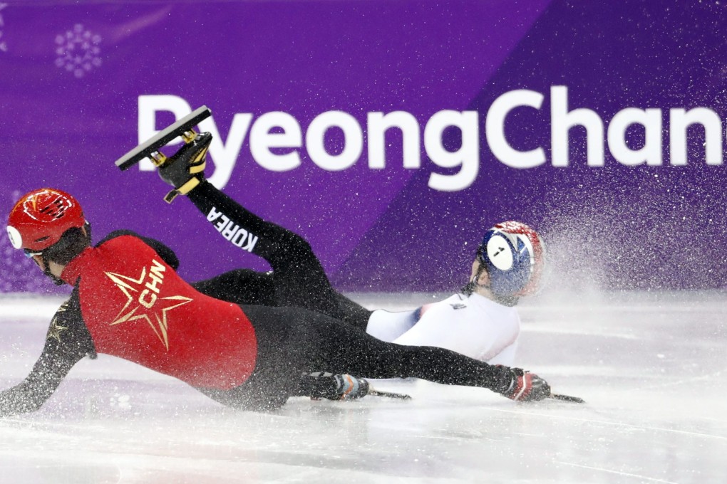 Two short-track speedskaters crash at the 2018 Winter Olympics in Pyeongchang. Photo: Reuters