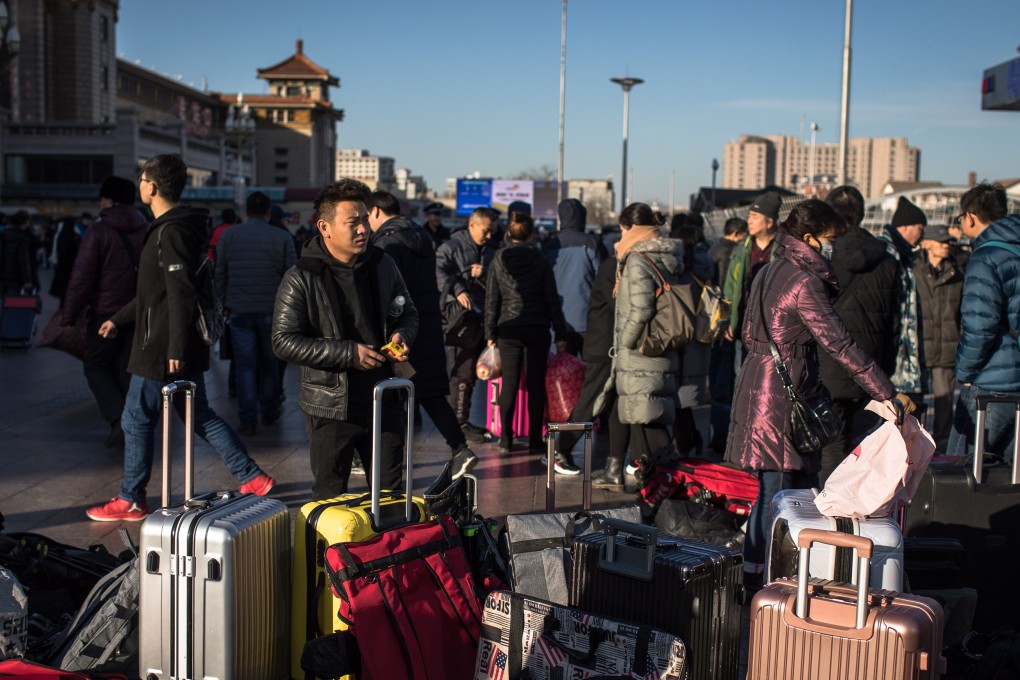 Passengers at Beijing railway station get ready for the journey ahead on Monday. Photo: EPA
