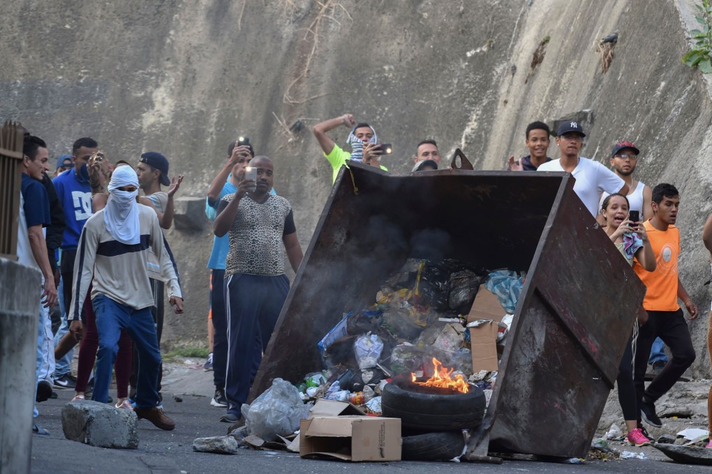Protesters demonstrate against Venezuela’s president Nicolas Maduro in front of the Cotiza Bolivarian National Guard headquarters in Caracas, Venezuela on January 21, 2018. Photo: AFP