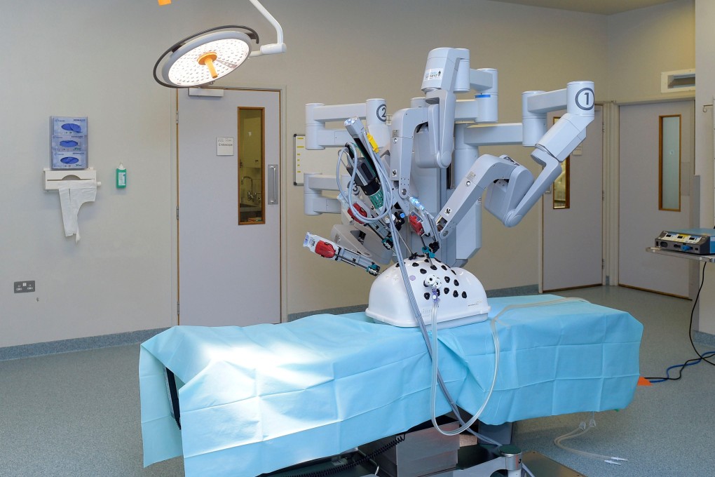 The da Vinci surgical system is the first FDA-approved system that involves devices using tele-manipulation of articulating arms operated by a surgeon sitting at a console with video monitor and joystick/pedal controls. Photo: Alamy