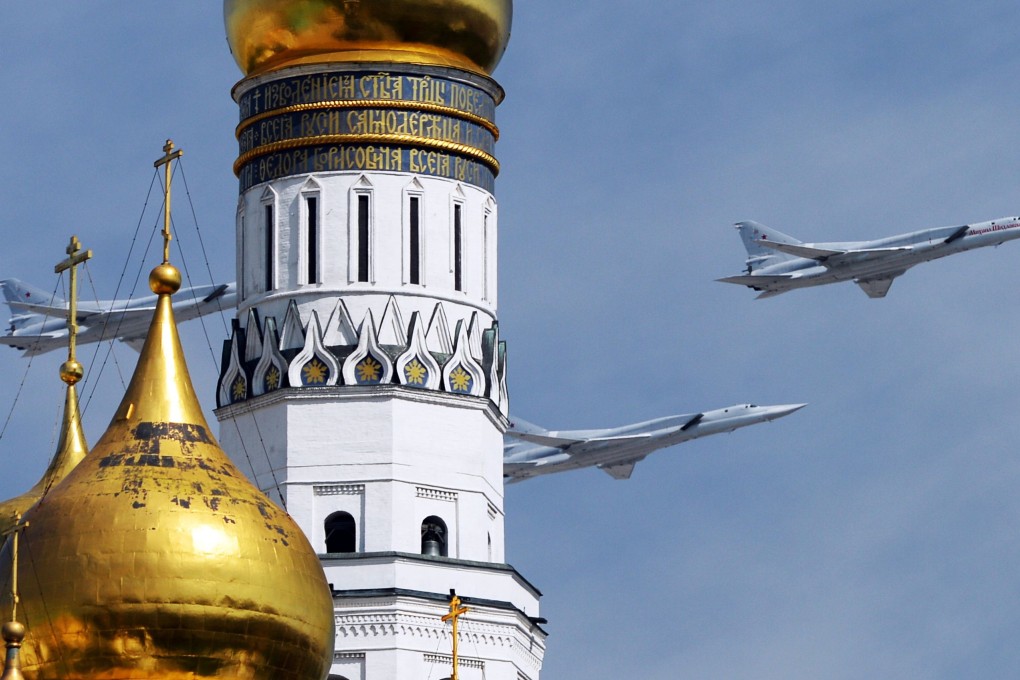 Tupolev Tu-22M3 Backfire strategic bombers fly over Red Square in Moscow on May 9, 2015. Photo: AFP