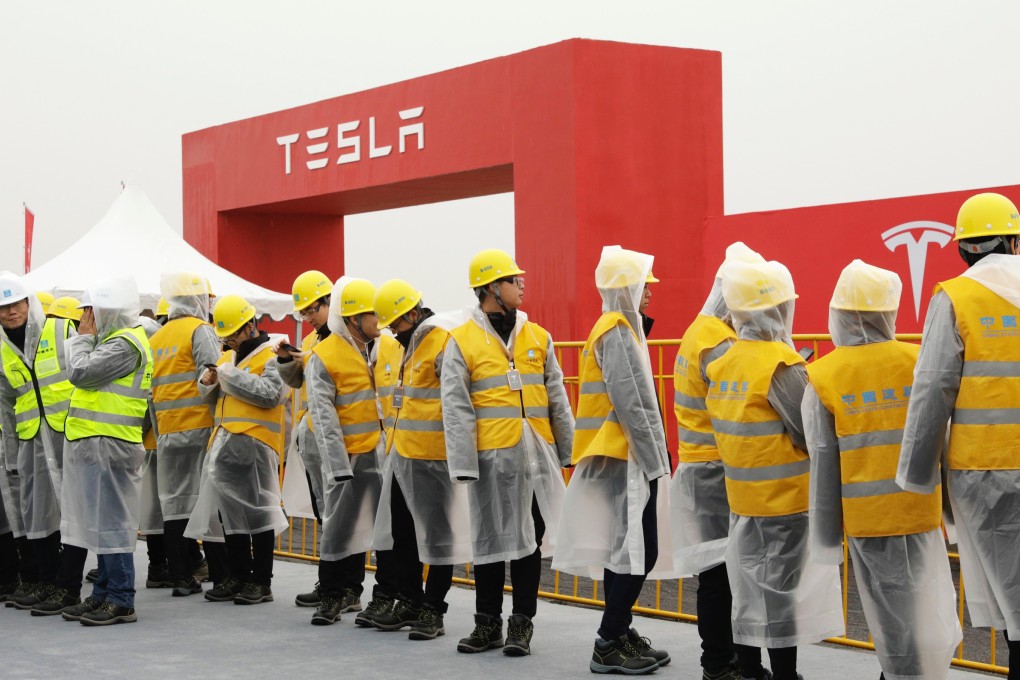 Workers at the site of the Tesla manufacturing facility in Shanghai. The US carmaker broke ground on its planned US$5 billion factory on January 7, 2019. Photo: Bloomberg