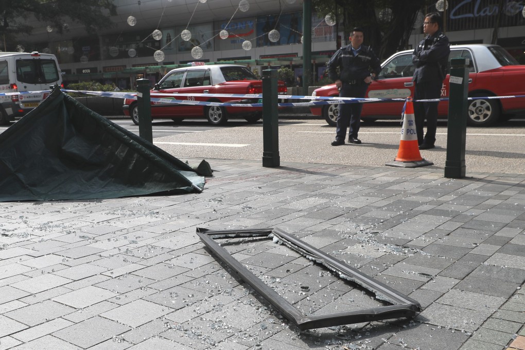A window that police believe fell from the 16th floor of The Mira Hong Kong hotel and hit a pedestrian lies on the pavement. Photo: Edmond So