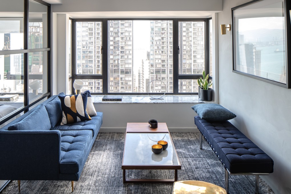 A concrete finish on the walls adds warmth to this Peggy Bels-designed flat in Sai Ying Pun. Photography: Eugene Chan