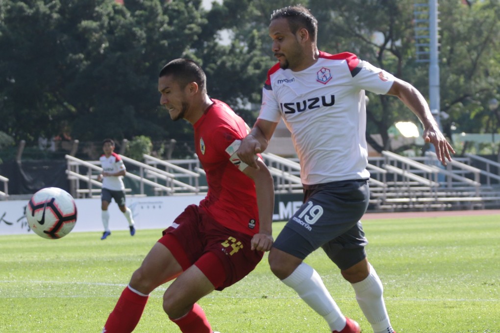 Hoi King’s Philip To (24) and Southern’s Dhiego Martins (19) battle for the ball. Photo: HKFA