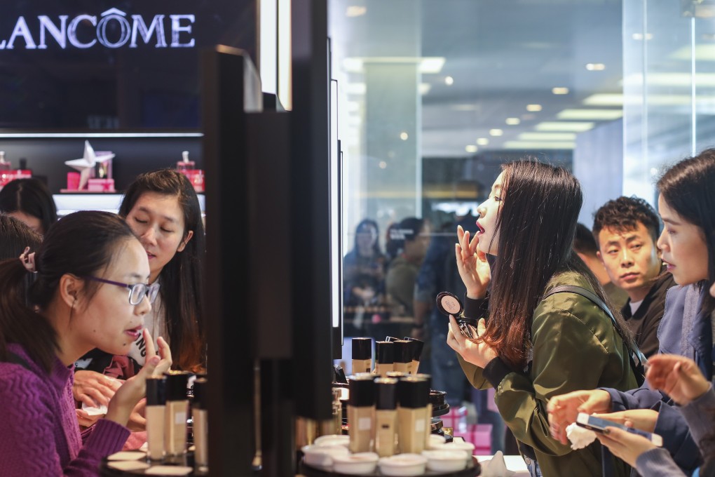Shoppers in Tsim Sha Tsui try out cosmetics in this photo taken on December 22, 2018. Photo: Xiaomei Chen