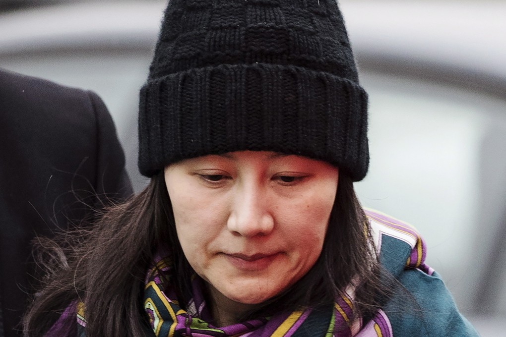 Huawei chief financial officer Meng Wanzhou arrives at a parole office with a security guard in Vancouver, British Columbia. (Darryl Dyck/The Canadian Press via AP, File)