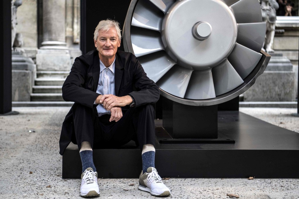 Founder of the Dyson company, designer James Dyson, poses next to a model of a Dyson engine in a 2018 file photo. Photo: AFP
