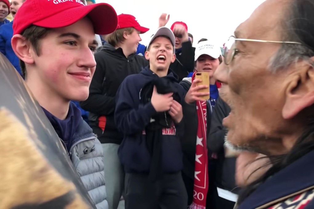 Nick Sandmann, a student from Covington Catholic High School, stands in front of Native American Vietnam veteran Nathan Phillips in Washington, in this still image from a January 18 video by Kaya Taitano. Photo: Kaya Taitano / via Reuters