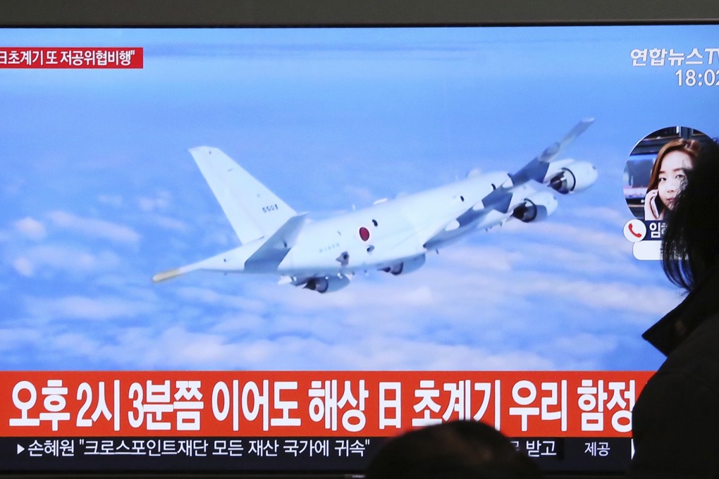 A South Korean news programme showing file footage of a Japanese patrol plane. Photo: AP