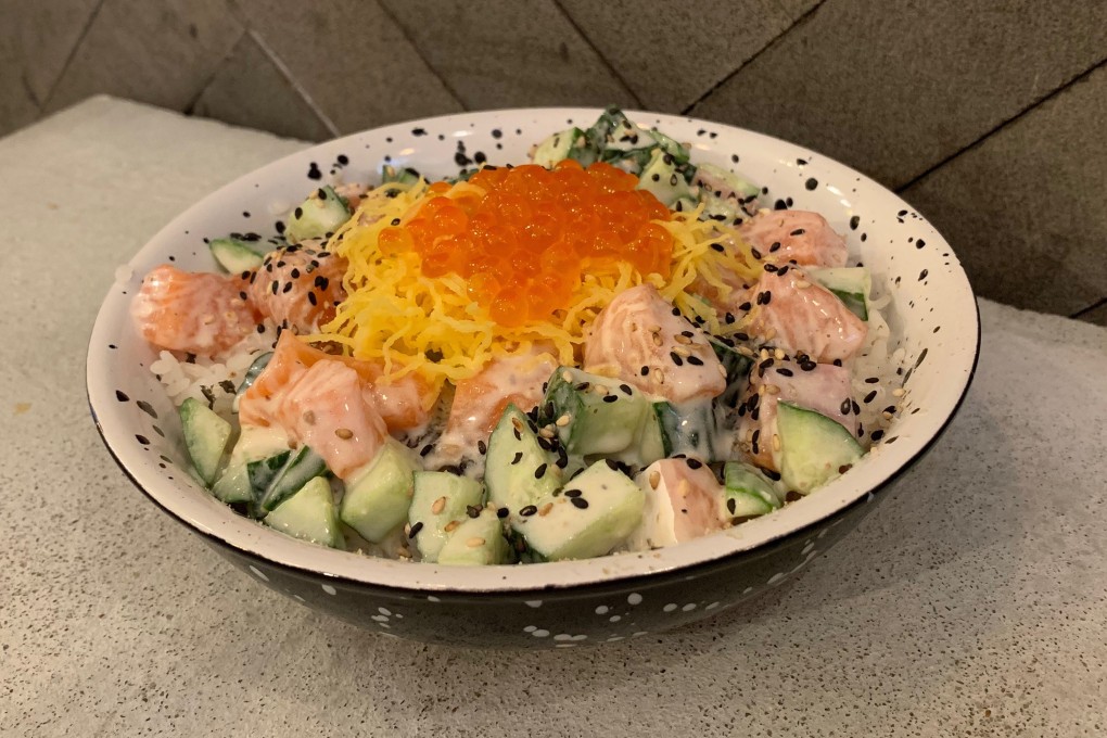 The California poke bowl at Peek-A-Poke includes salmon poke with cucumber, shredded egg and salmon roe with a “nutty buddy” sauce. Photo: Simone McCarthy