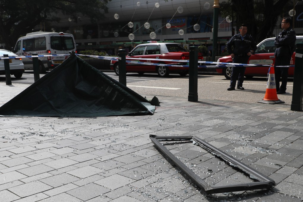 Shattered glass from a window that fell from The Mira Hotel and killed a pedestrian in Tsim Sha Tsui. Photo: Edmond So