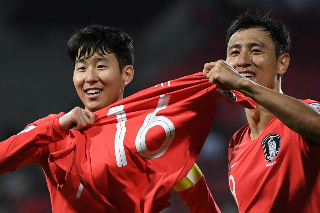 Son Heung-min (left) and Ji Dong-won celebrate a 2-1 victory over Bahrain in the round of 16 at the AFC Asian Cup in Dubai. Photo: EPA