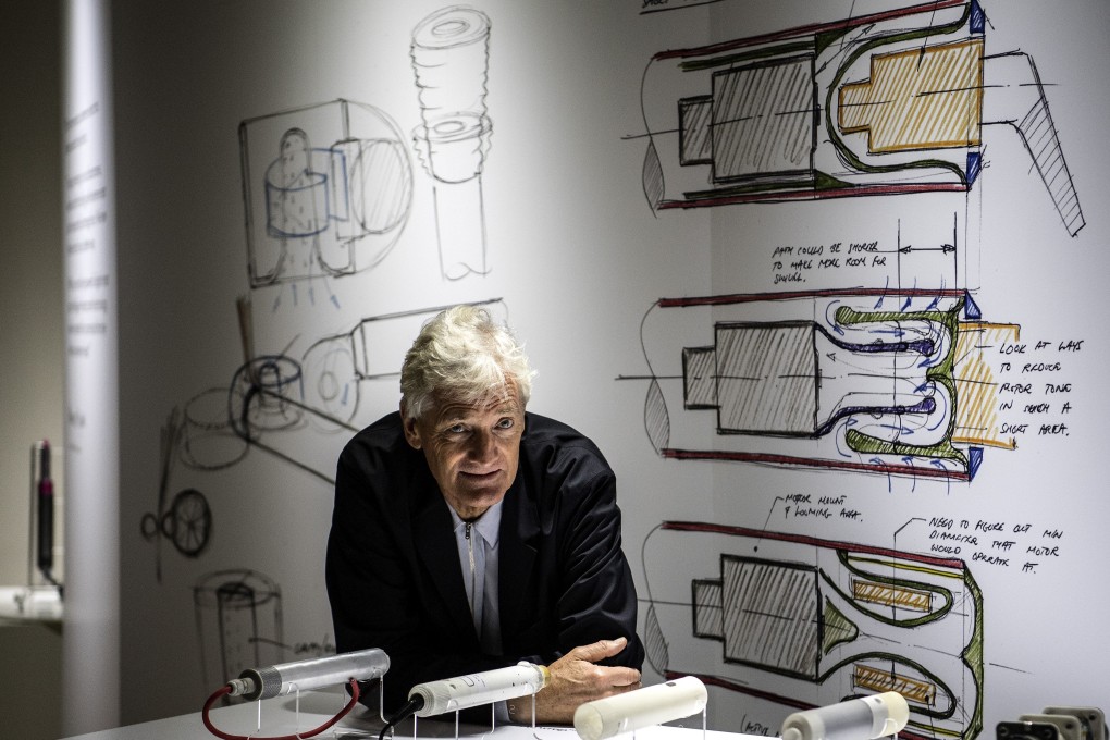 British industrial design engineer and founder of the Dyson company, James Dyson, poses with products during a photo session at a hotel in Paris on October 11, 2018. Photo: AFP