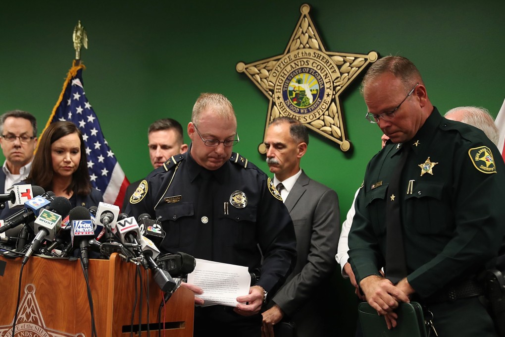 From left: Ashley Moody, Florida’s attorney general, Karl Hoglund, Sebring’s chief of police, and Paul Blackman, the sheriff of Highlands County, at a news conference on Thursday about the shootings at a SunTrust Bank branch in Sebring, Florida, on Wednesday. Photo: AFP