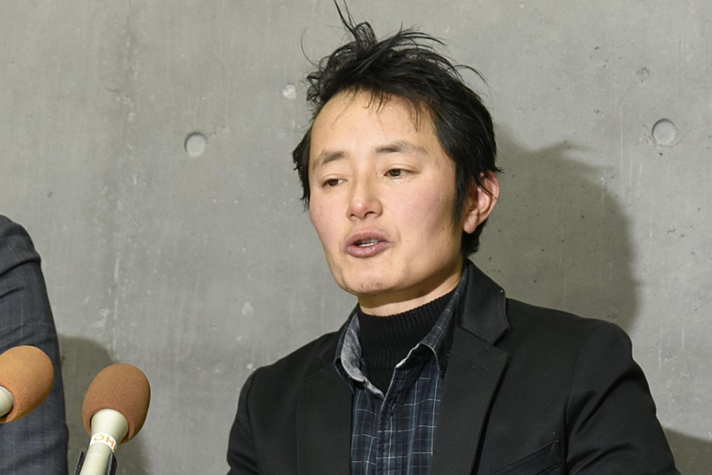 Takakito Usui speaking at a press conference in Okayama after the Supreme Court’s ruling. Photo: Kyodo