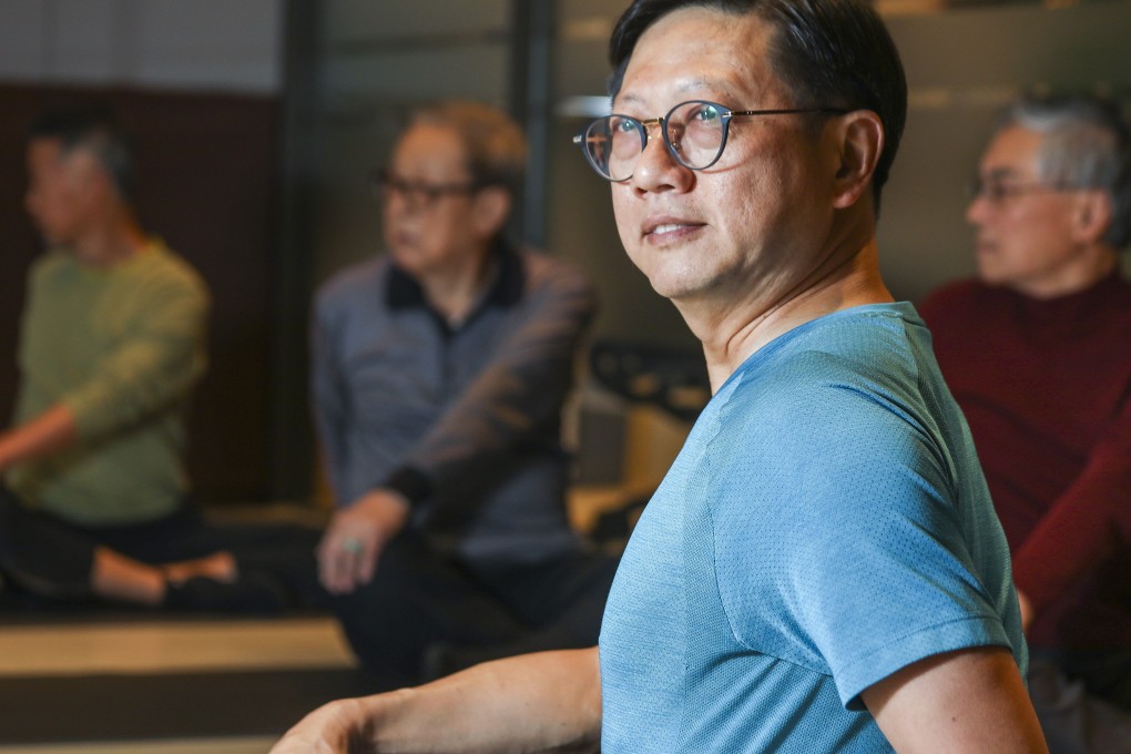 Collin Ng Kwok-lam teaches a yoga class for men only at CancerLink Support Centre in North Point, Hong Kong. Photo: Xiaomei Chen
