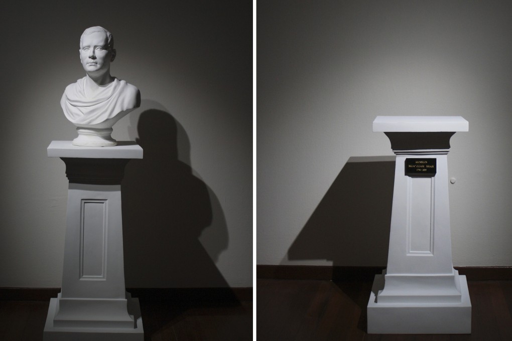 An art installation, The Most Mild-Mannered Man, comprising of a bust of Sir Stamford Raffles placed across from an empty pedestal bearing the name of Sultan Hussein Shah of Johor, who signed the treaty allowing the British to set up a trading post in Singapore. Photo: Clara Chow