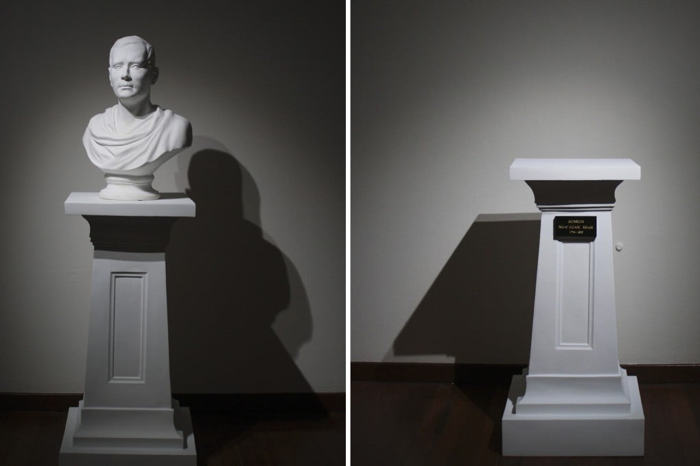 An art installation, The Most Mild-Mannered Man, comprising of a bust of Sir Stamford Raffles placed across from an empty pedestal bearing the name of Sultan Hussein Shah of Johor, who signed the treaty allowing the British to set up a trading post in Singapore. Photo: Clara Chow