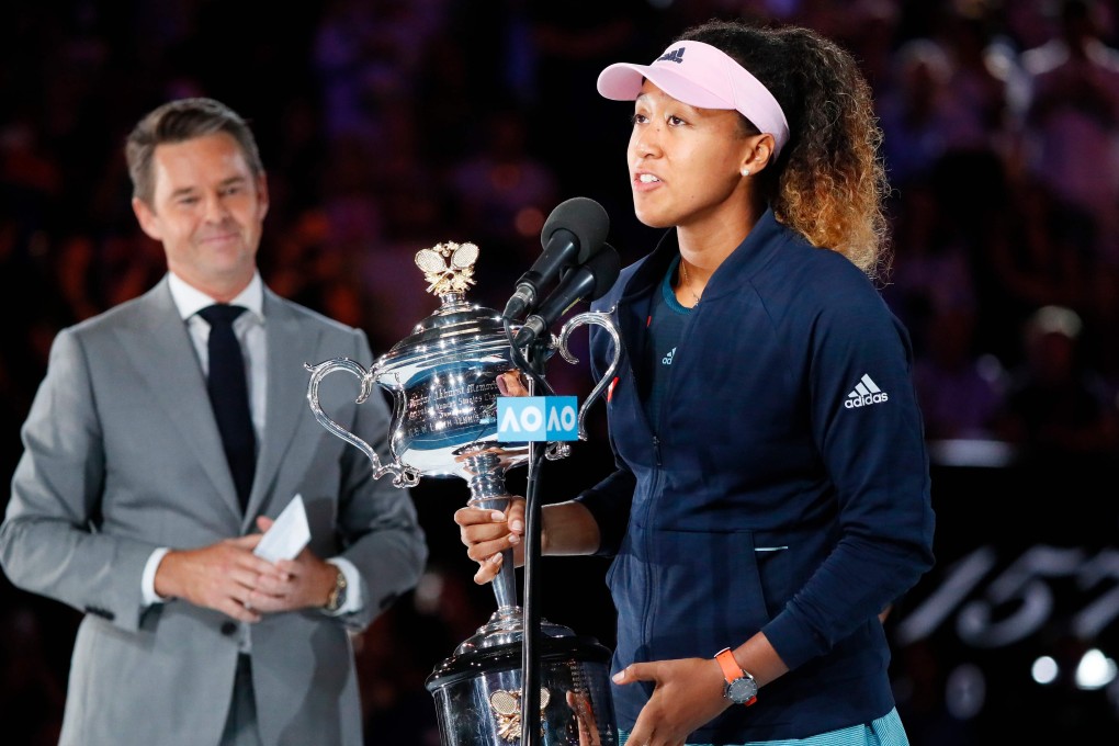 Naomi Osaka celebrates with the championship trophy after winning the Australian Open final. Photo: AFP