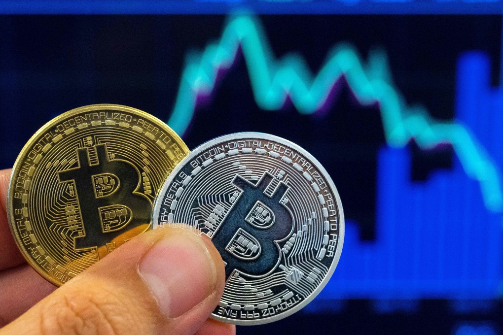 Chinese cryptocurrency exchanges are seeking reverse mergers in Hong Kong, which allows them to acquire control of publicly traded firms in the city and bypass the lengthy initial public offering process. Photo: Agence France-Presse