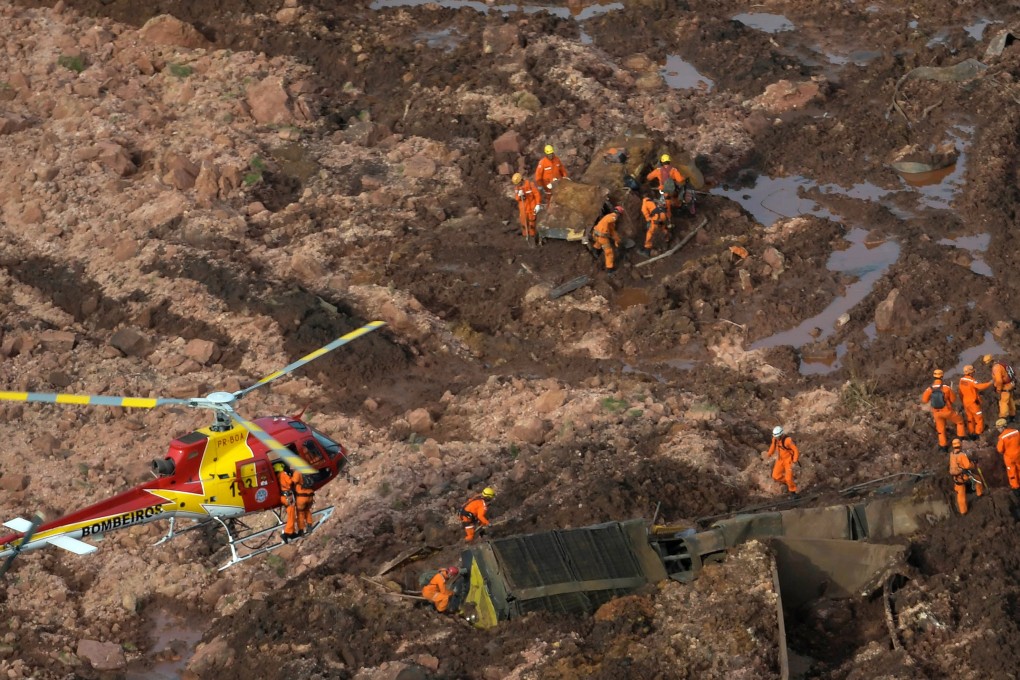 Rescue crews at the site of a burst dam administered by miner Vale SA in Brumadinho, Brazil, on Friday. Photo: Reuters