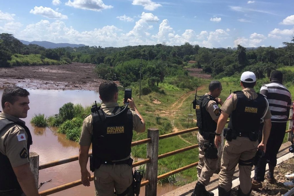 Police officers are seen after a dam, owned by Brazilian miner Vale SA, burst in Brumadinho, Minas Gerais, Brazil January 25, 2019. Photo: Reuters