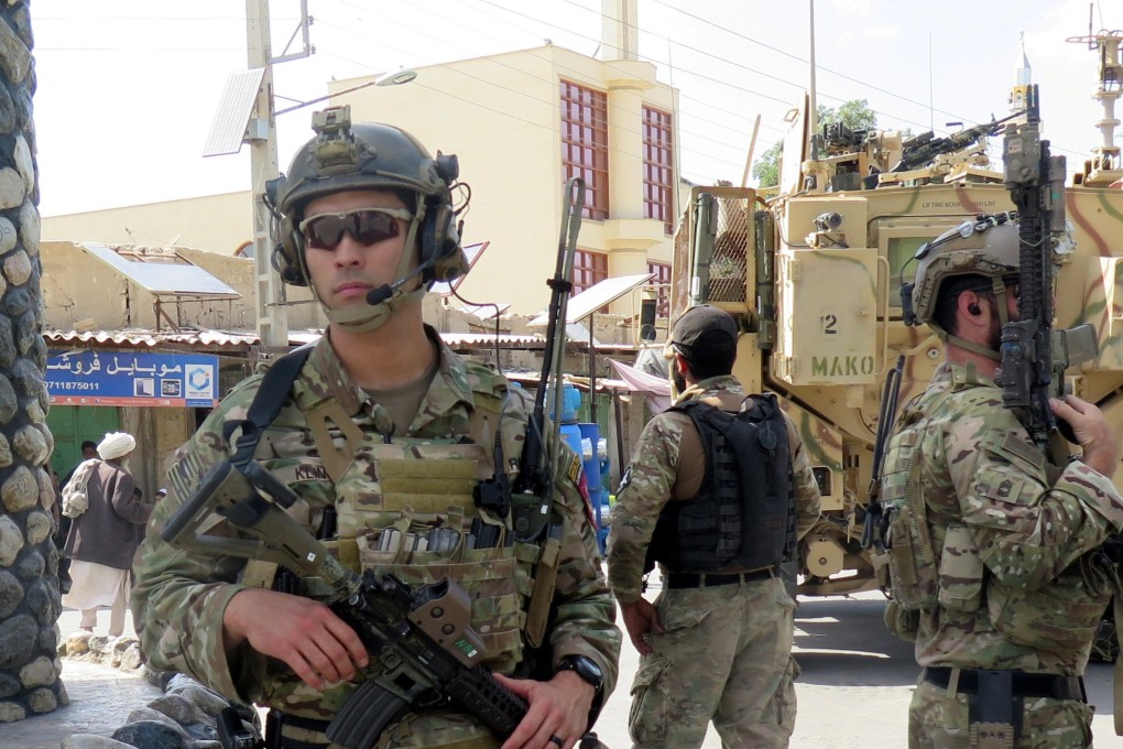 US troops keep watch during an official visit in Farah province, Afghanistan. Photo: Reuters