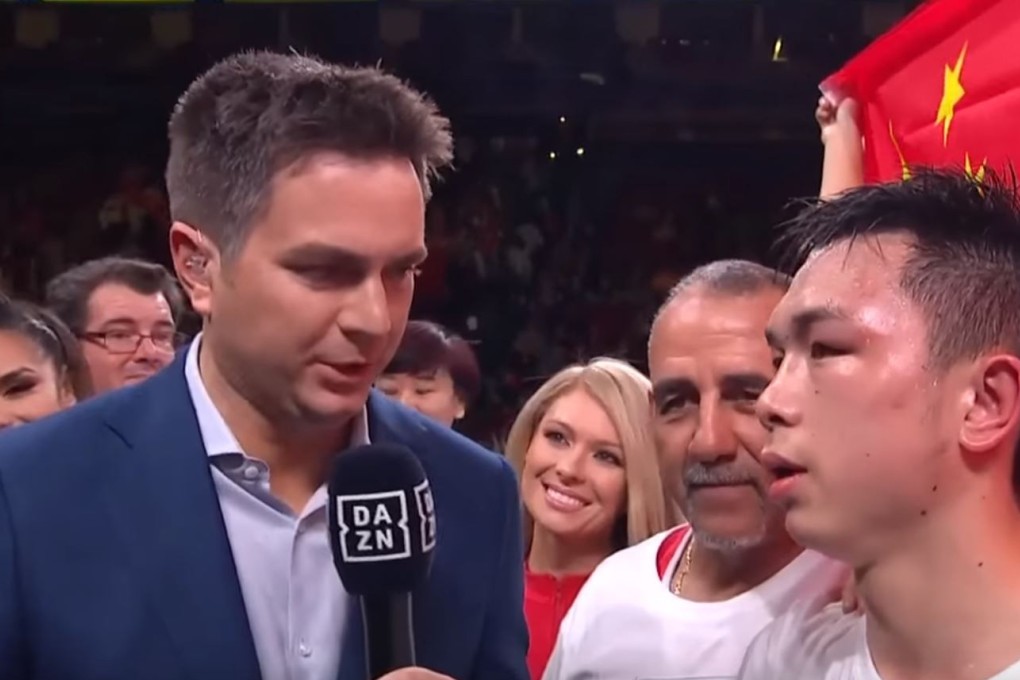 Chinese boxer Xu Can conducts his post-fight interview after winning his world title. Photo: YouTube/DAZN USA
