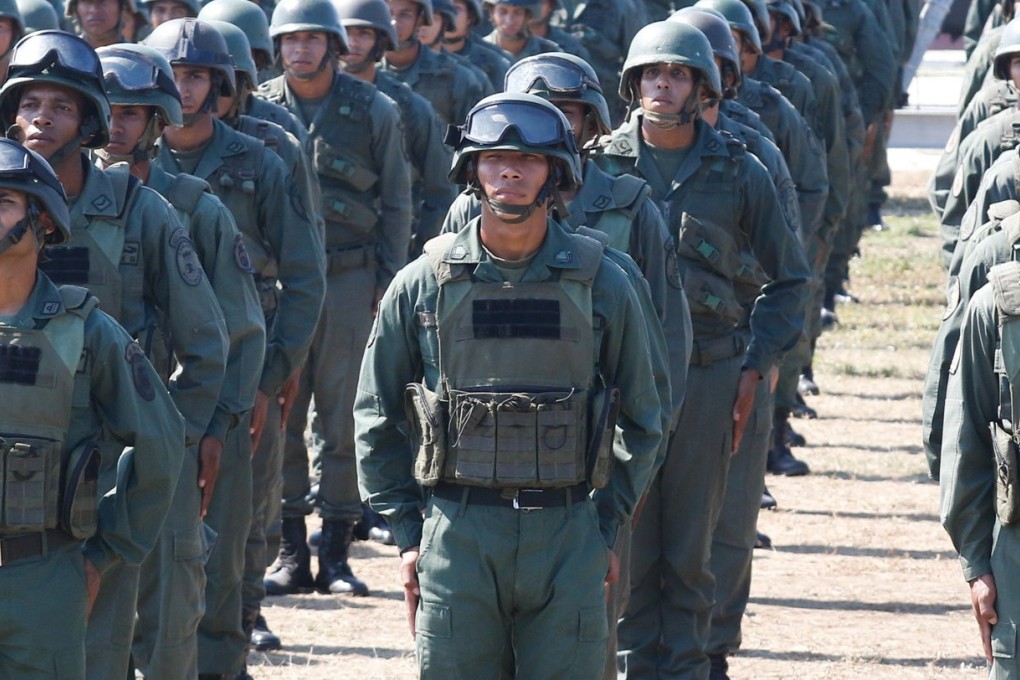 The prize is Venezuela’s military – and on Sunday both sides of the deepening crisis in Caracas worked to win it. Photo: Reuters