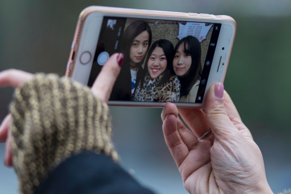 The Timeless mobile app, created by Emma Yang, uses an artificial intelligence-powered facial recognition system to help Alzheimer’s patients identify people in photos. Photo: Agence France-Presse