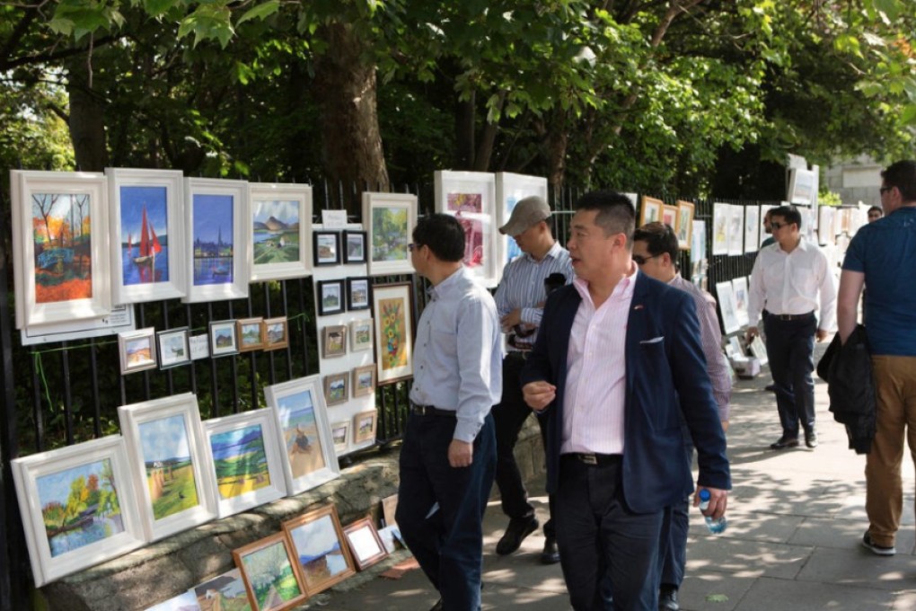 Chinese tourists at a Sunday art market in Dublin. The Hong Kong service to Dublin has contributed to an expansion in trade and tourism. Photo: Handout