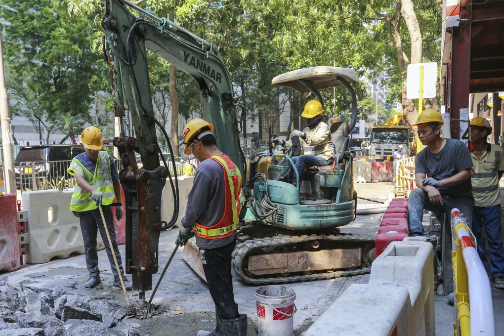 Construction workers at a building site in Wan Chai. Photo: Dickson Lee