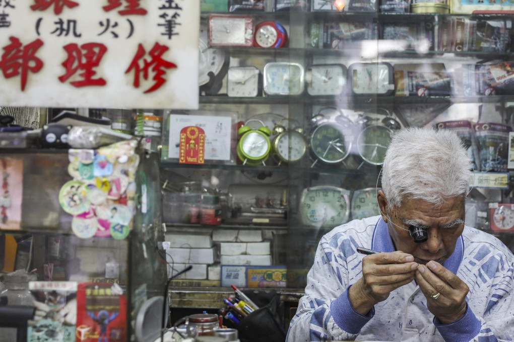 An elderly worker at a watch shop in Kwun Tong. The government’s announcement that only people aged 65 and over would be eligible to receive the elderly CSSA rate has sparked public debate. Photo: Sam Tsang