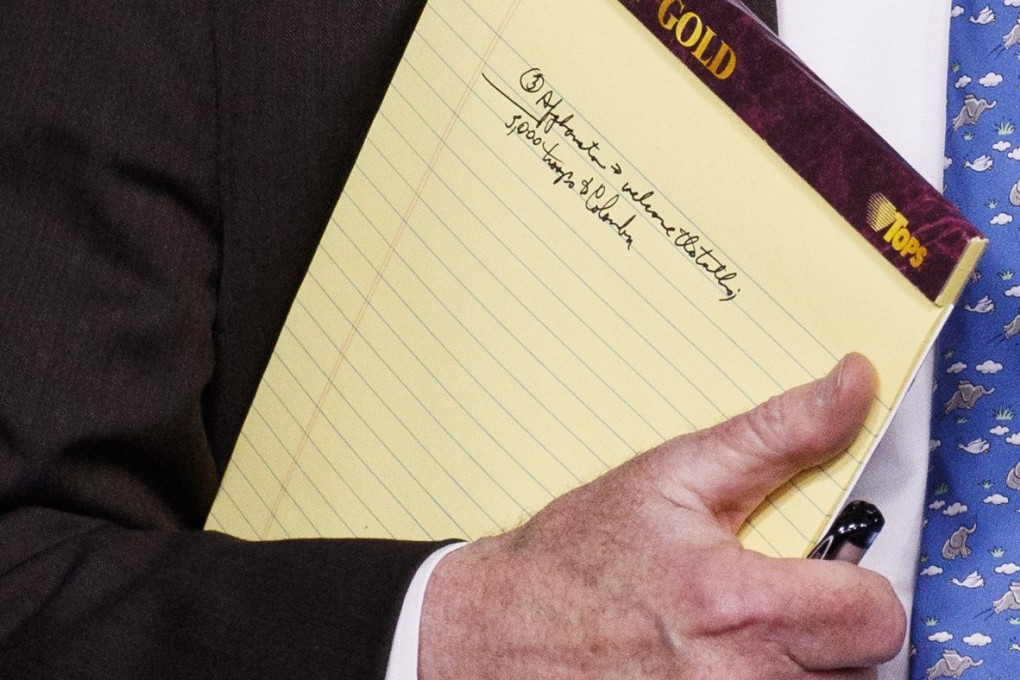 US National Security Adviser John Bolton holds his notes during a press briefing at the White House on Monday. The note “5,000 troops to Colombia” hints at a possible US troop deployment amid the ongoing crisis in Venezuela. Photo: AP
