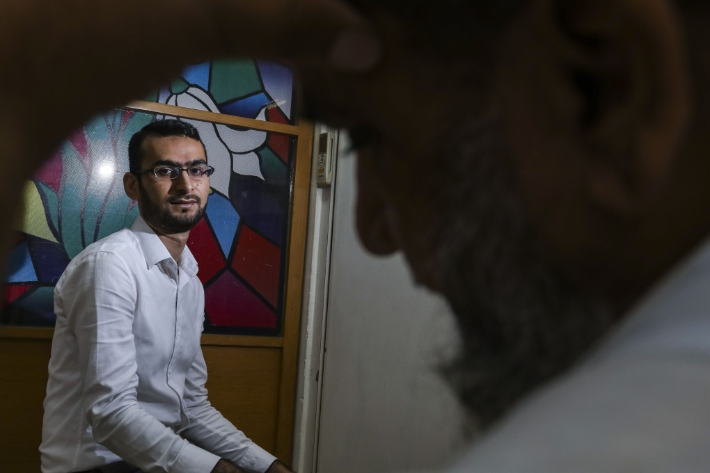 Shoaib Hussain (left), who works at a centre which specialises in liaising with medical staff on interpretation, poses with a 44-year-old man from Pakistan who has lived in Hong Kong for more than 20 years and, due to the language barrier, only recently discovered that he has diabetes and heart ailments. Photo: Nora Tam