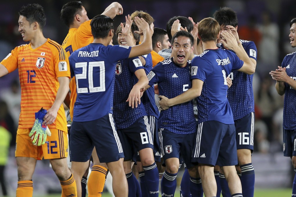 Japan defender Yuto Nagatomo celebrates with teammates after the AFC Asian Cup semi-final win over Iran. Photo: AP