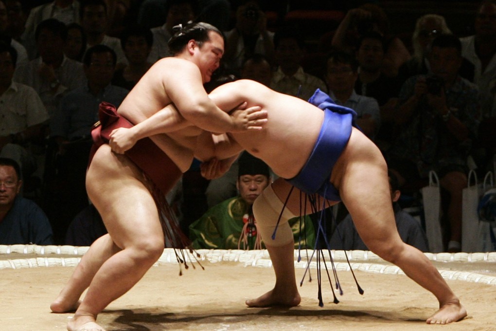 Sumo wrestlers fight at the Grand Sumo Tournament in Hawaii 2007. Photo: Agence France-Presse