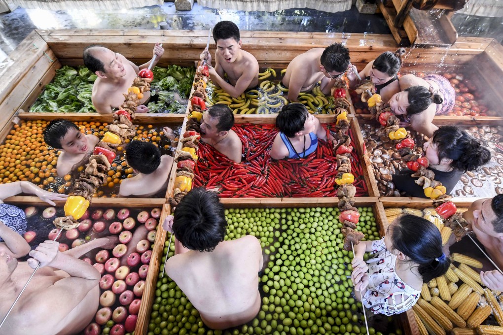 People enjoying a dip in a hotpot-shaped hot spring pool at a hotel in Hangzhou in China’s Zhejiang province. Photo: AFP