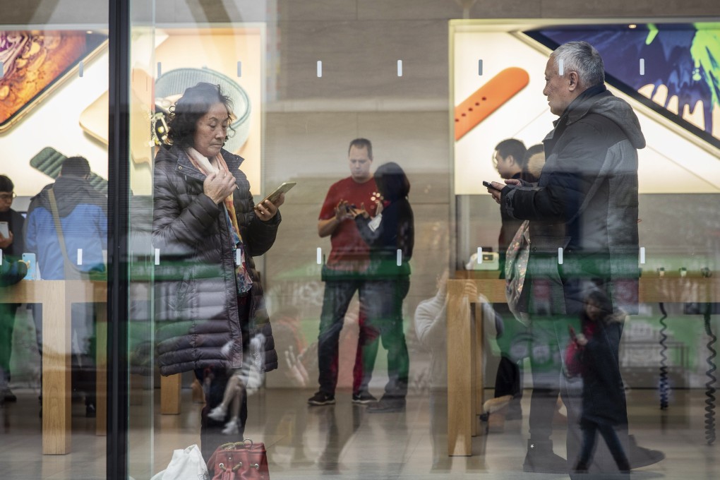 Shoppers browse inside an Apple store in Shanghai. Consumption remains the largest growth contributor in China’s economy, making up 76 per cent of fourth-quarter GDP growth. Photo: Bloomberg