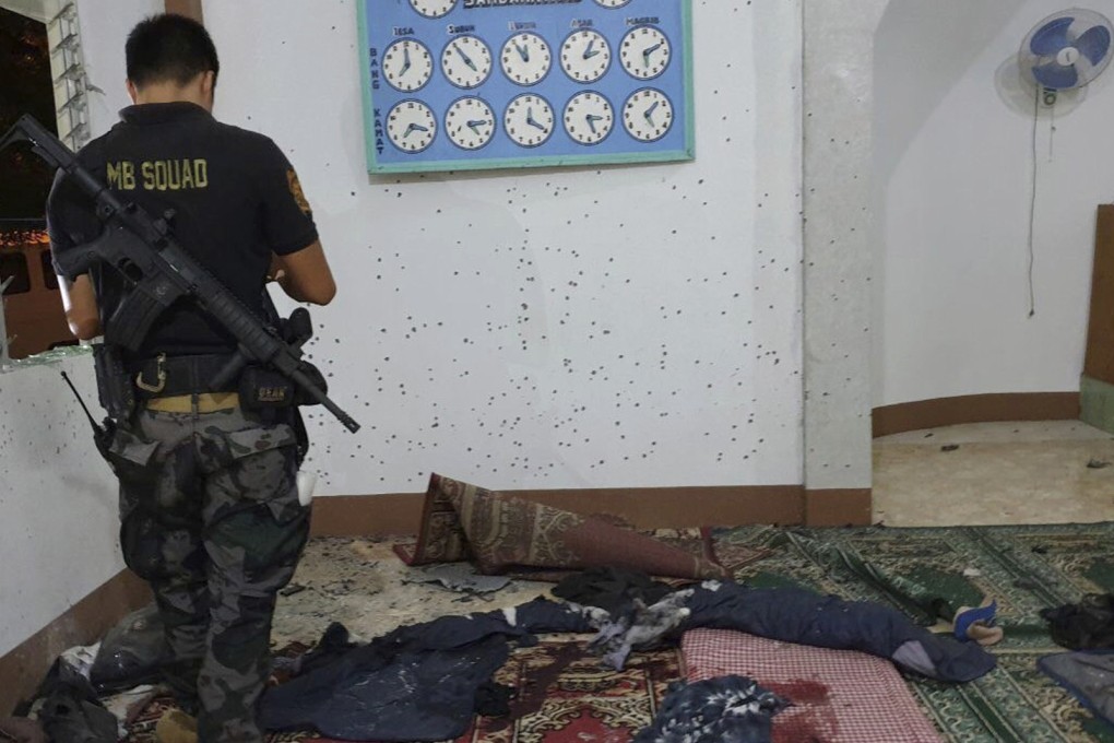 A police investigator examines the scene of the grenade attack. Photo: AP