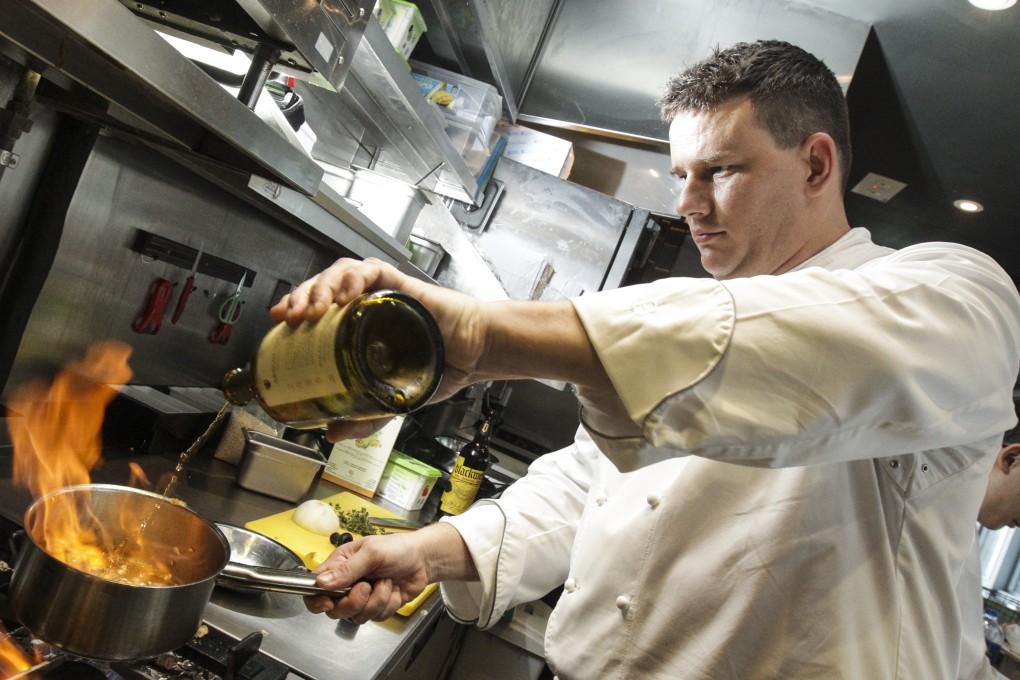 Philippe Orrico cooking spelt risotto with Comté and vin jaune, morels and brown jus at ON Dining restaurant in Central, Hong Kong. The restaurant is closing after six years in business. Photo: Dickson Lee