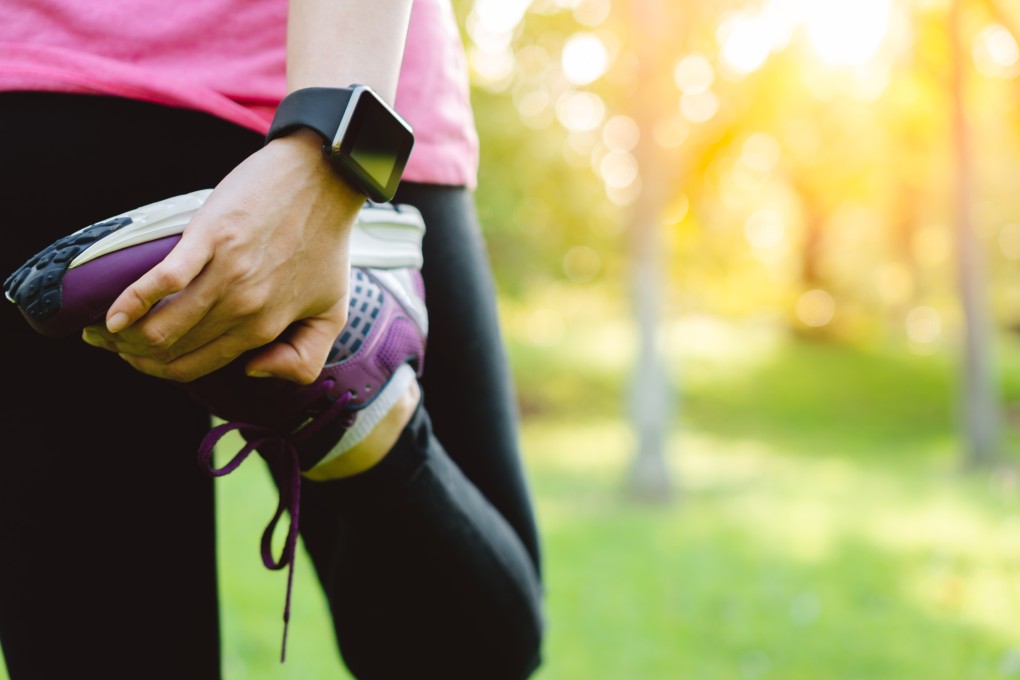 A runner stretches before a workout. But when did we start calling our leisure activities ‘work’? Photo: Shutterstock