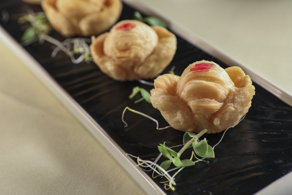 Gold-ingot-shaped pastries filled with custard at 10 Shanghai restaurant in Causeway Bay, Hong Kong. Photo: Nora Tam