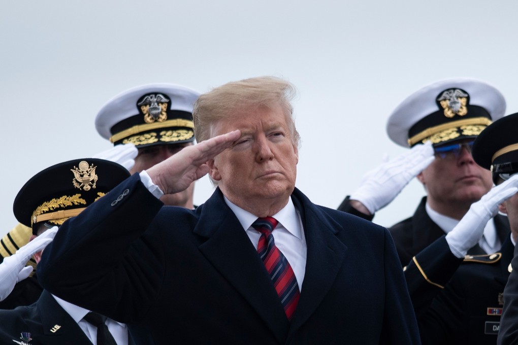 US President Donald Trump and others pay their respects to Scott A. Wirtz, a Defence Intelligence Agency civilian and former Navy Seal who was killed in a suicide bombing in Syria. Photo: AFP