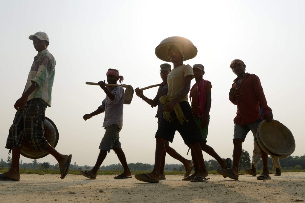 Indian labourers near a construction area of a new railway in Janakpur. Photo: AFP