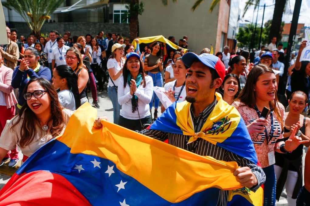 epa07332311 Venezuelan opposition protesters participate in a demonstration to demand the end of the crisis and in support of the interim presidency of Juan Guaido, in Caracas, Venezuela, 30 January 2019. National Assembly leader Juan Guaido declared himself interim president of Venezuela on 23 January and promised to guide the country toward new election as he consider last May's election not valid. EPA-EFE/Cristian Hernández