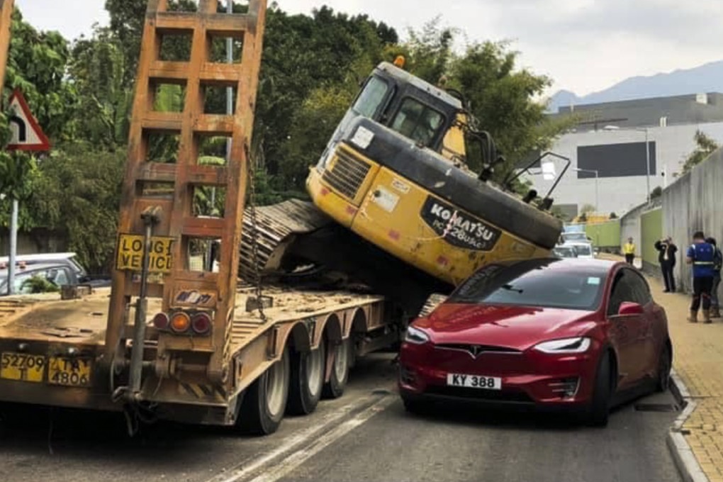 There were two people inside the Tesla sedan when the accident happened. Both escaped serious injury. Photo: Facebook